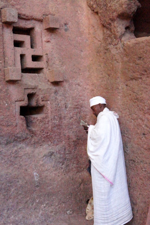 praying on the wall, including an ancient swastica style cross