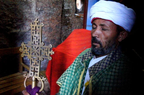 A priest with his cross